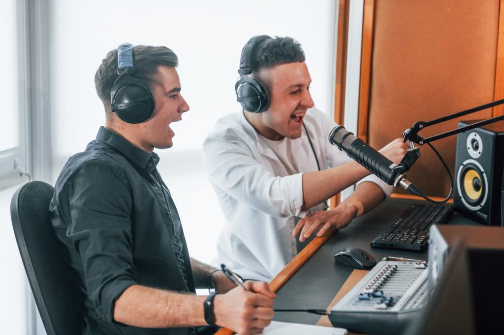 Two Guys Is Indoors In The Radio Studio Is Busy By Broadcast 1024x682